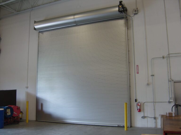 White panelled garage door fitted to a two-car garage